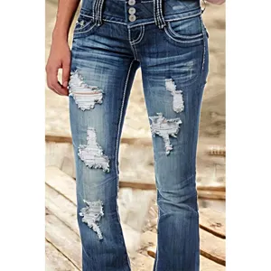 Close-up detail shot of vintage distressed low-rise denim jeans with multi-button front.