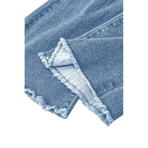 Blue denim jeans frayed raw hem detail close-up view, classic retro washed denim long pants.