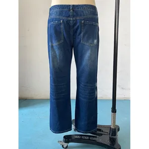 Dark blue women's straight denim jeans, mid-waist ripped back view detail showing washed style.