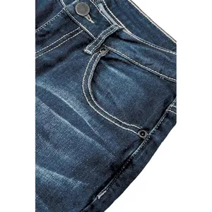 Detailed view of women's dark blue denim jeans featuring contrast stitching and button.
