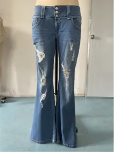 Close-up detail of vintage low-waist distressed flare jeans featuring multi-button design.