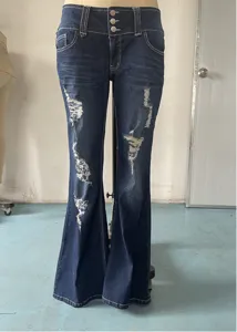 Women's vintage dark blue low-waist ripped flare jeans with multi-button closure detail.