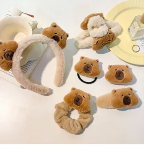 Cute brown plush Capybara hair accessories set with headband, clips, and scrunchies.