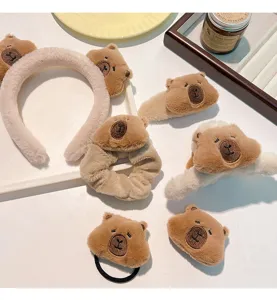 Cute plush capybara themed hair accessories including headband, scrunchie and claw clips