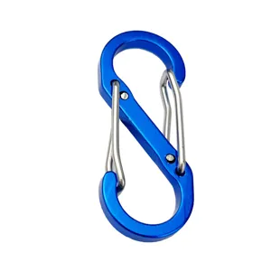Close-up of blue aluminum S-biner hook, double spring gate detail for outdoor gear.