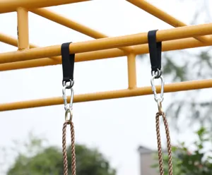Detail view of outdoor swing hanging strap with metal carabiner and durable polyester material.