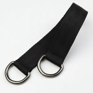 Outdoor swing hanging strap detail, black polyester webbing with metal D-rings for sturdy extension.
