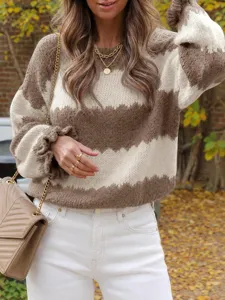 Detail view of the cozy brown and white colorblock chevron knit sweater in autumn setting.