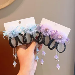 Detail of Hanfu floral hair clips with faux braids and tassels for little girls.