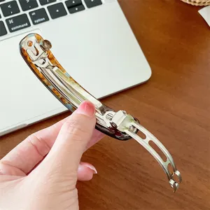 Detailed view of the metal spring mechanism of an elegant acetate hair clip