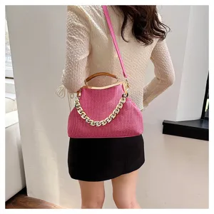 Modern pink shell handbag with chunky gold chain and textured striped finish for women