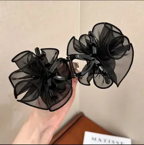 Elegant 8cm black mesh flower hair claw clip for bun hairstyles and high ponytails.