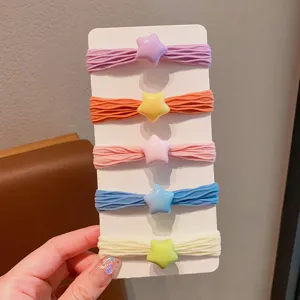 Set di cinque elastici per capelli color caramella con ciondoli a stella lucidi per ragazze