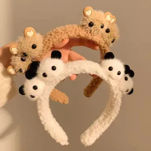Detailed view of soft plush headbands featuring cute panda and bear cartoon characters.