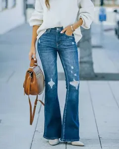 Women's dark blue washed distressed flared jeans, high waist stretch denim long pants detail.