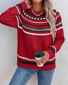 Detailed view of women's colorblock knit sweater, stylish long sleeve pullover in red and black.