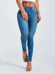 High-waisted skinny denim jeans detail view, featuring stretchy fabric and slim fit design.