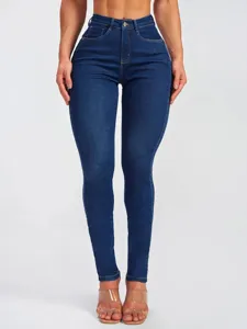 Detailed view of high waisted stretch skinny jeans, fitted denim trouser detail.