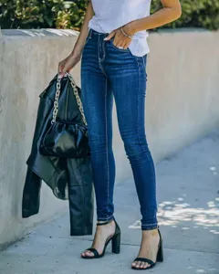 Women's dark blue skinny denim jeans featuring high-waisted fit and contrast stitching detail.