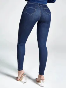 Detailed view of high-waisted skinny stretch denim jeans in dark blue, back view.
