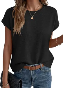 Detailed shot of womens black textured short sleeve knit top highlighting fabric and fit design.