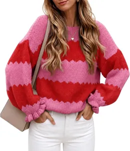 Close-up detail of the vibrant pink and red color block knit sweater with comfortable crewneck.
