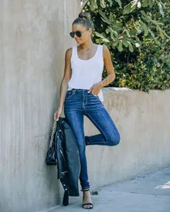 Women's slim fit skinny denim jeans detail view, classic washed blue casual long pants.