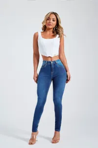 Women high-waisted stretch skinny jeans paired with a white crop top, fashion casual style.