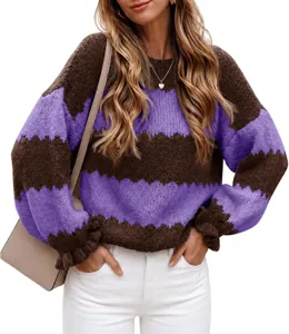 Detailed view of women's colorblock knit sweater, long sleeve crewneck pullover top.