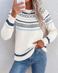Close-up view of a chic women's geometric colorblock crewneck long sleeve knit sweater.
