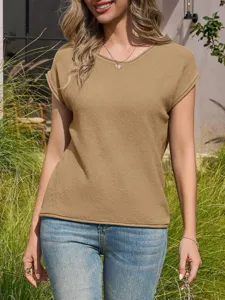Detailed view of women's short sleeve knit top, casual crewneck pullover in solid camel color.