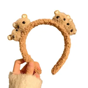 Cute plush teddy bear headband for face washing with soft fuzzy sherpa material.