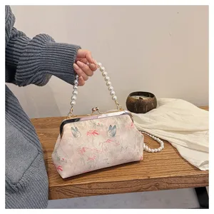Elegante Kussverschluss-Tasche aus Stoff mit Schmetterlingsmotiv und Perlengriff