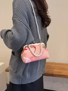 Elegante rosa florale Kussmund-Abendtasche mit Perlengriff und langem Schultergurt