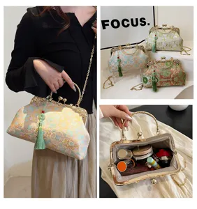 Detailed view of embroidered vintage handbags featuring tassels and elegant chain straps