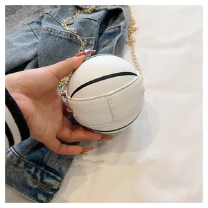Handheld close-up showing the texture of a white basketball-shaped mini PU round bag