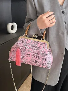 Vintage rosa Handtasche mit Paisley-Muster, Bambusgriffen und dekorativer Quaste am Rand