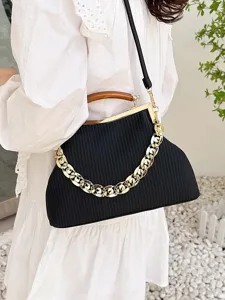 Elegant black striped shell handbag with chunky gold chain and wooden handle