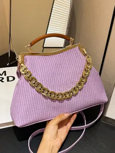 Stylish lavender woven frame handbag with a chunky gold chain and acrylic handle