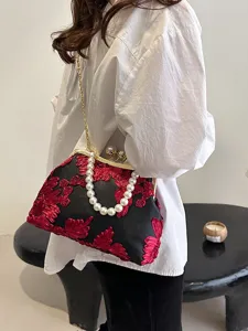 Elegant vintage black mesh handbag with red floral embroidery, pearl handle and gold chain