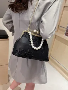 Vintage black floral embroidery evening bag with pearl handle and gold chain strap