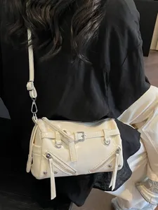 Vintage cream soft leather pillow bag featuring silver buckle and zipper tassel accents