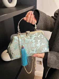 Elegante pochette da sera ricamata azzurra con nappa decorativa e catena dorata