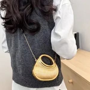 Stylish gold acrylic crescent evening bag with textured finish and elegant metal chain strap