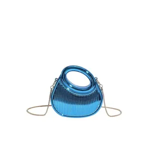 Glossy blue acrylic crescent evening bag with ribbed texture and chain strap