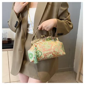 Elegant Chinese style embroidered handbag with green tassel and golden chain strap