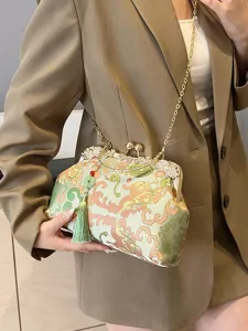 Elegant embroidered handbag featuring green tassels and gold chain strap for casual wear
