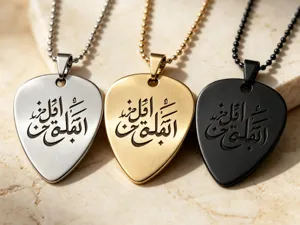 Stainless steel guitar pick pendant necklace featuring elegant engraved Arabic calligraphy script.