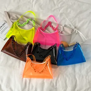 Vibrant multi-color transparent PVC jelly bags with chunky plastic chain handles for women.