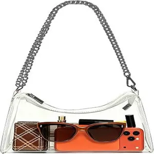 Interior view of transparent PVC shoulder bag with sunglasses and orange phone